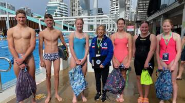 Head coach Ketrina Clarke with South Esk swimmers at this year's age and multi-class national championships. Picture supplied